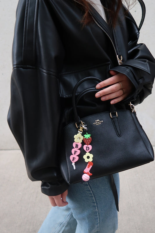 3-D printed Bag charms on a black coach bag